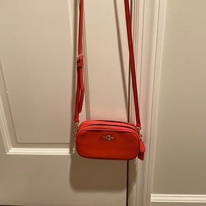Coach crossbody - fits a phone and a card wallet for gals on the go. Happy color